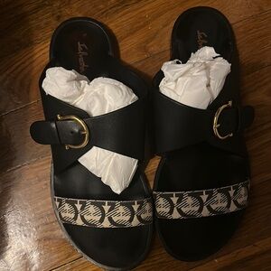 Salvatore Ferragamo Black and Tan Sandals with Elegant Design